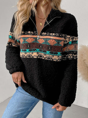 Women's quarter zip geometric long sleeve sweatshirt in black with colorful tribal print.