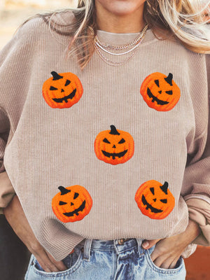 Halloween pumpkin drop shoulder sweatshirt with playful pumpkin designs, perfect for festive autumn style.