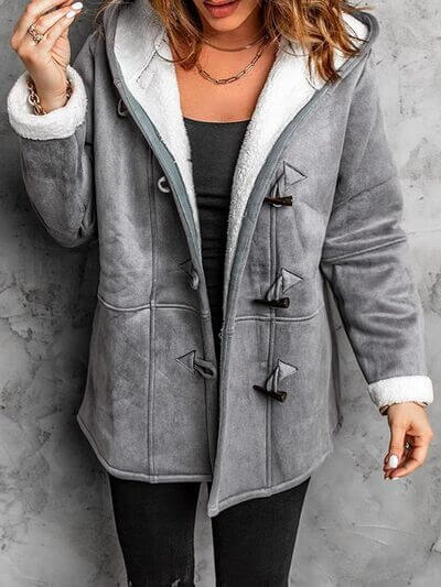Full size pocketed long sleeve hooded toggle jacket in grey with soft lining, perfect for casual styling.