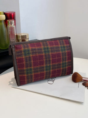 Contrast plaid clutch with zipper, small polyester bag showcasing rich colors, perfect for storing cosmetics or small items.