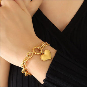 Half Chunky Chain Titanium Steel Bracelet with heart charm on wrist, elegant and stylish accessory for any outfit.