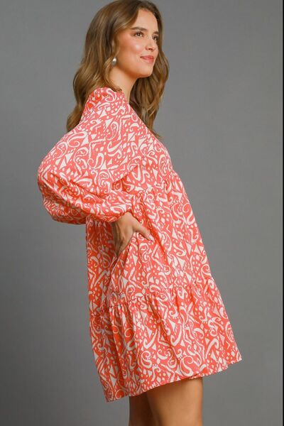Umgee boho print balloon sleeve tiered dress in coral with elegant design and flowy silhouette, perfect for contemporary style.