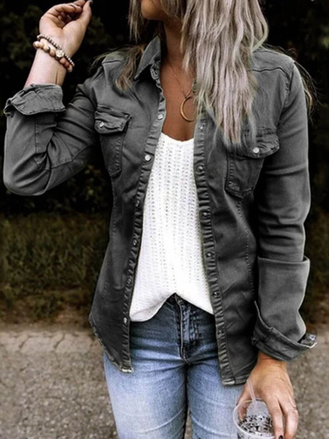 Woman wearing a Full Size Snap Down Long Sleeve Shacket over a white top with casual jeans, ideal for stylish layering.