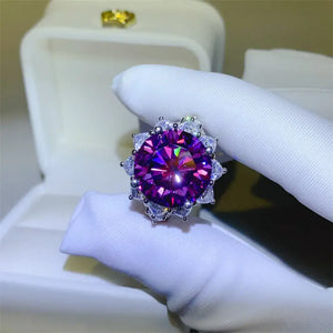 10 Carat Moissanite flower shape ring set in 925 sterling silver, showcasing a vibrant purple stone.