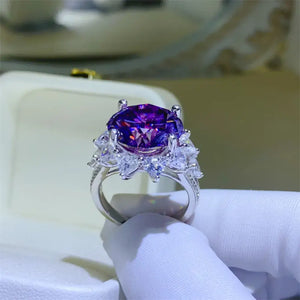 10 Carat Moissanite flower shape ring in 925 sterling silver, showcasing a vibrant purple center stone.