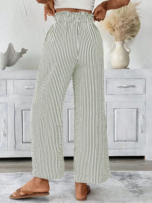 Full size striped wide leg paper bag pants in green, showcasing a pocketed design and comfortable fit.