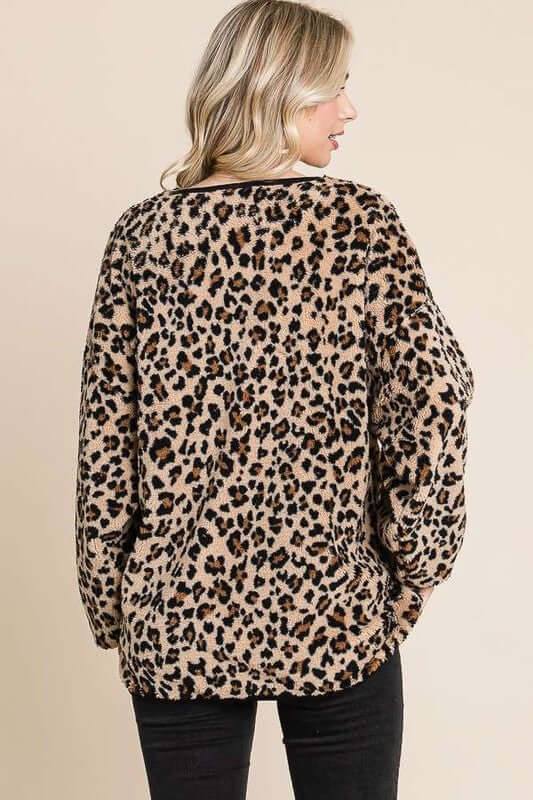Back view of the stylish Leopard Faux Fur Round Neck Top showcasing its chic leopard print design.