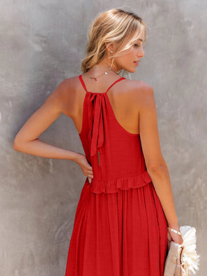 Back view of a ruffled sleeveless tiered maxi dress in red, showcasing tied straps and a flared skirt.