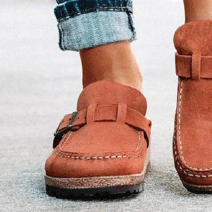 Close-up of round toe low heel buckle loafers in rust color, showcasing stylish casual footwear for women.