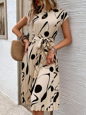 Tied pleated printed cap sleeve dress with abstract black and beige design, featuring a bow at the waist.