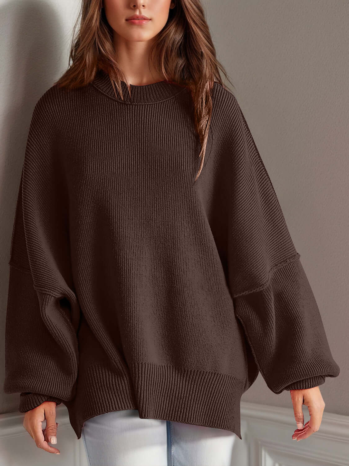 Chic side-slit sweater with a cozy round neck, perfect for winter fashion and comfort.