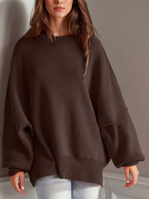 Chic side-slit sweater with a cozy round neck, perfect for winter fashion and comfort.