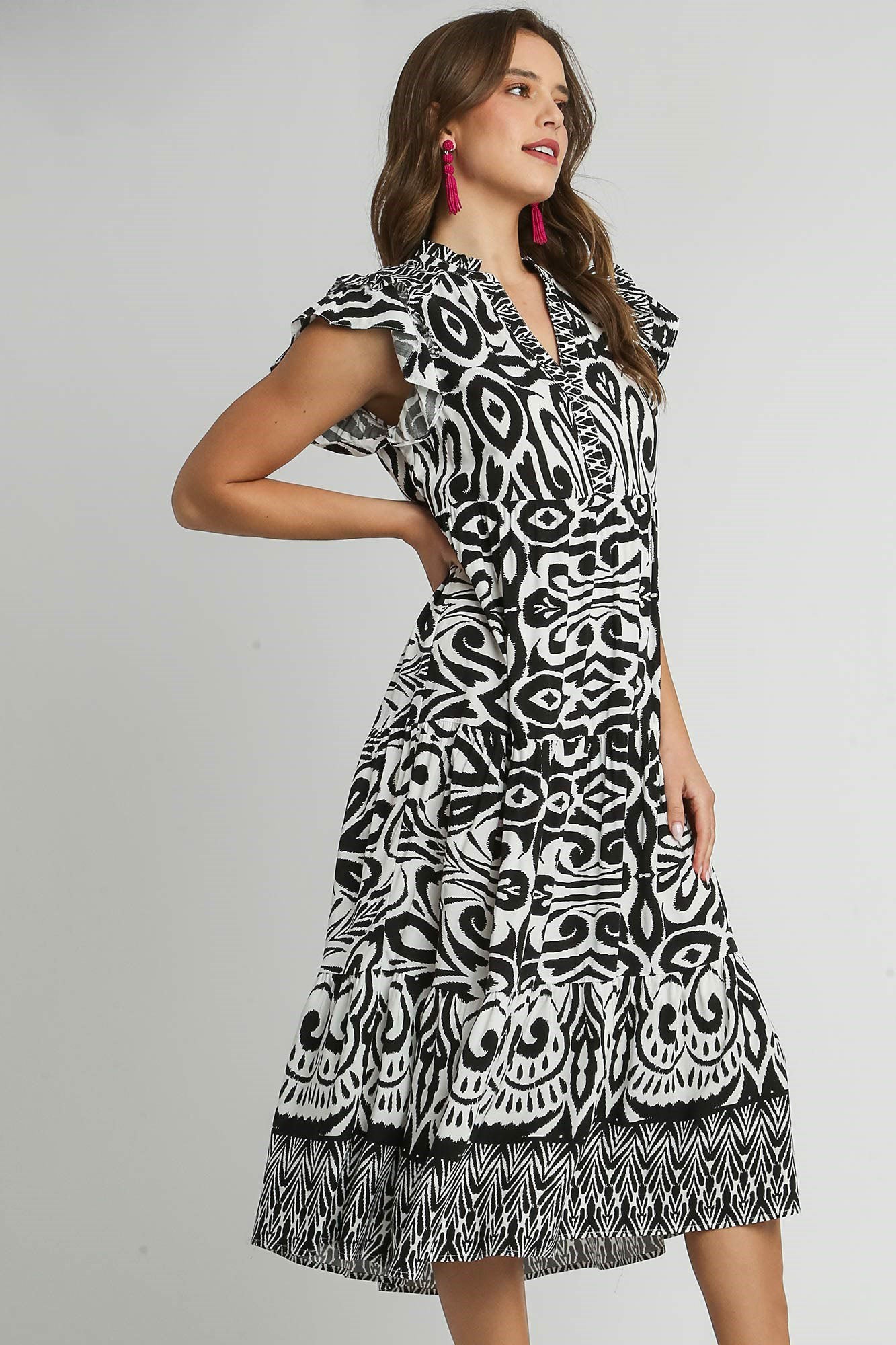 Umgee plus size two-tone midi dress with ruffle cap sleeves and black-and-white border print.