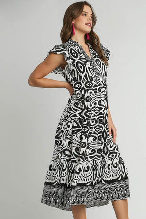 Umgee plus size two-tone midi dress with ruffle cap sleeves and black-and-white border print.
