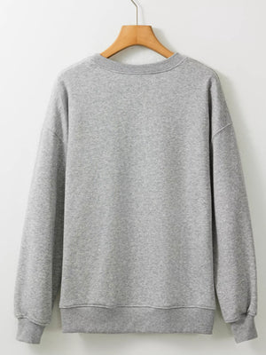 Back view of a gray Halloween ghost round neck sweatshirt on a hanger, showcasing its stylish design and durable material.