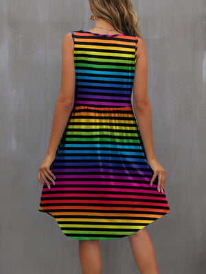 Back view of a colorful striped mini dress with wide straps, perfect for casual summer outings.