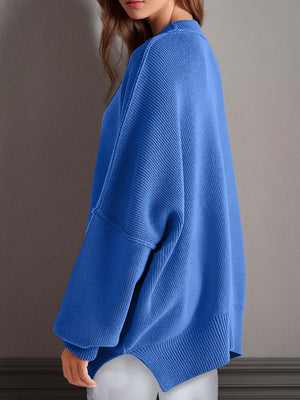 Chic side-slit sweater in blue with cozy round neck, showcasing soft, comfortable knit for winter style.