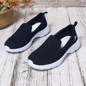 Lightweight breathable mesh slip-on shoes in navy blue with white soles, perfect for everyday comfort.