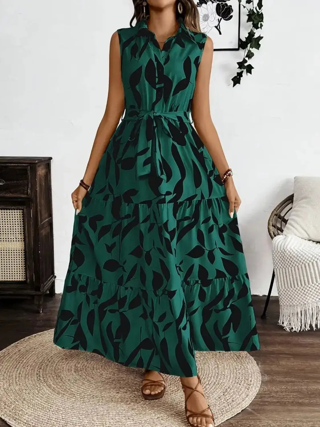 Printed tie waist sleeveless maxi dress in green with leaf pattern, perfect for casual summer outings.