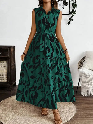 Printed tie waist sleeveless maxi dress in green with leaf pattern, perfect for casual summer outings.