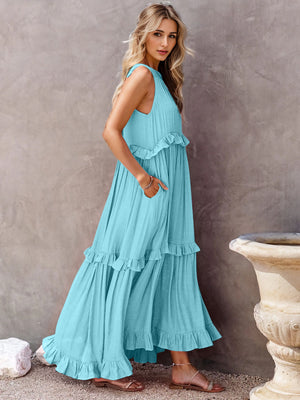 Ruffled sleeveless tiered maxi dress with pockets in light blue, showcasing a high-low design and comfortable fit.