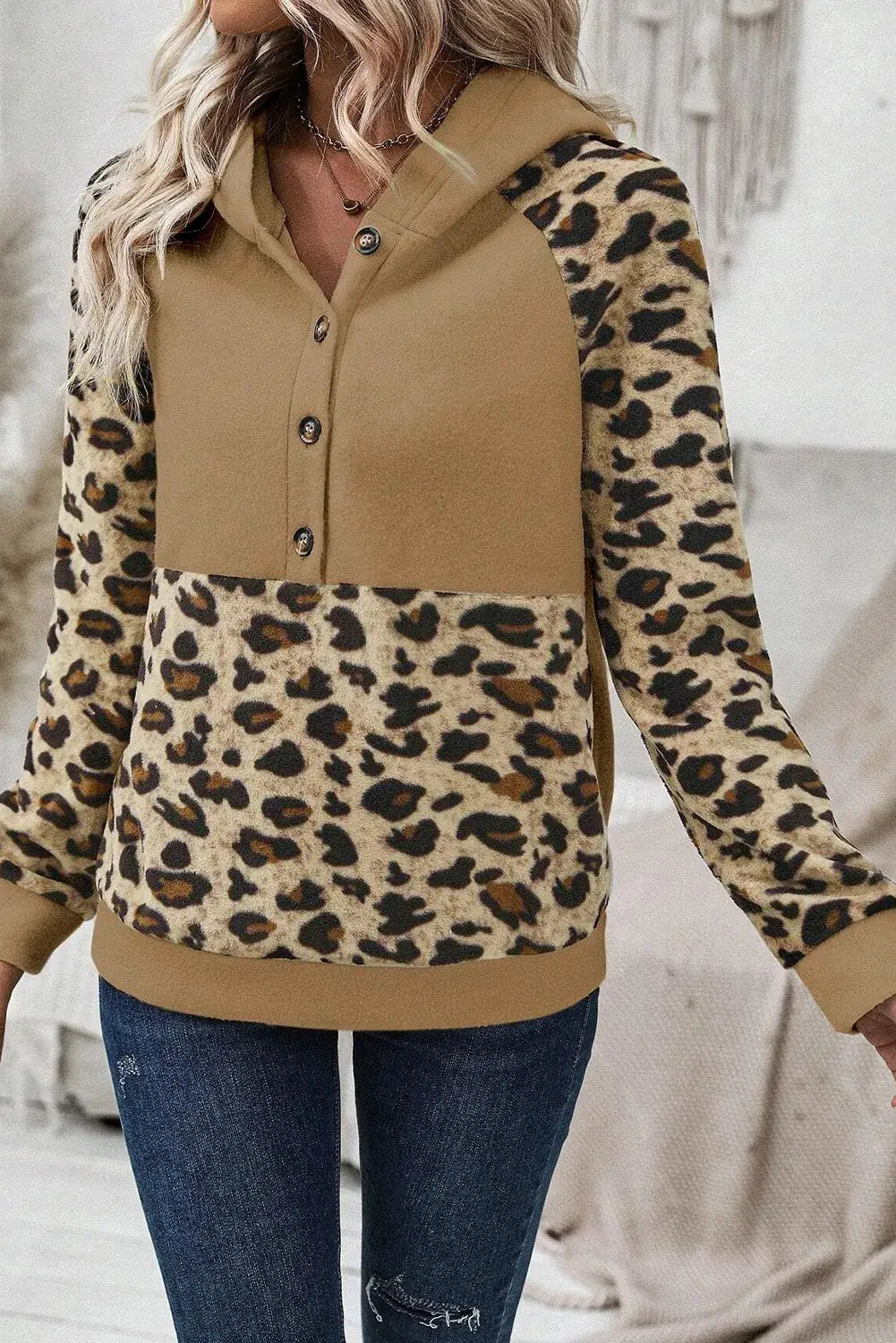 Stylish leopard half button long sleeve hoodie with a soft fabric, perfect for casual wear.