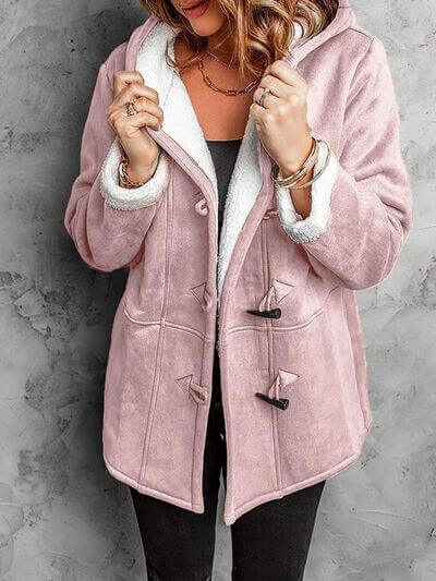 Cozy full size pocketed long sleeve pink hooded toggle jacket with buttoned closure and plush lining.