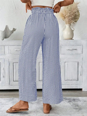 Back view of plus size striped wide leg paper bag pants, featuring a comfortable waistband and spacious pockets.