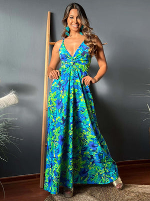 Twisted printed V-neck cami dress featuring vibrant blue and green floral patterns, styled on a model.