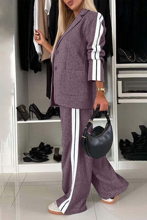 Fashionable full size contrast lapel collar top and pants set in purple with striped details, styled with a chic handbag.