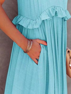 Detail of ruffled sleeveless tiered maxi dress with pockets in blue, showcasing stylish design and comfortable fit.