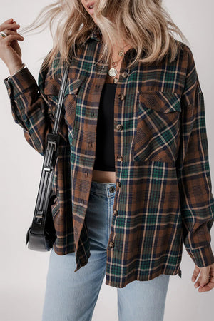 Plaid button-up long sleeve jacket styled with a black top and jeans, featuring front pockets and a relaxed fit.