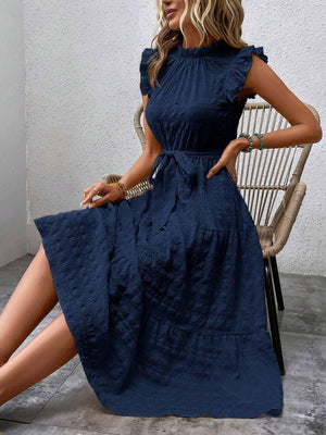 Tied ruffled cap sleeve midi dress in navy, showcasing a chic design and feminine silhouette, perfect for casual or semi-formal occasions.