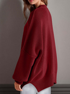 Chic side-slit sweater in rich burgundy with cozy round neck and relaxed fit, perfect for winter styling.