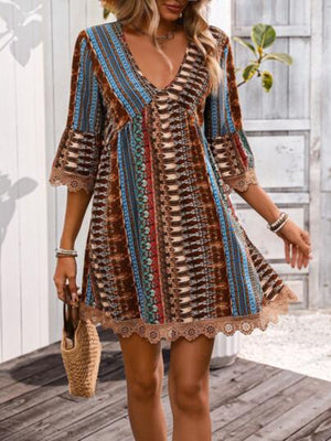 Lace trim printed V-neck 3/4 sleeve dress in vibrant colors, with bell sleeves and decorative hem, perfect for a stylish summer look.