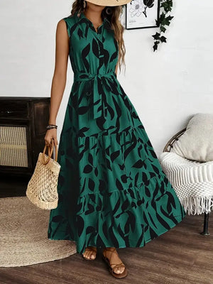 Printed tie waist sleeveless maxi dress in green with leaf print, perfect for summer outings.