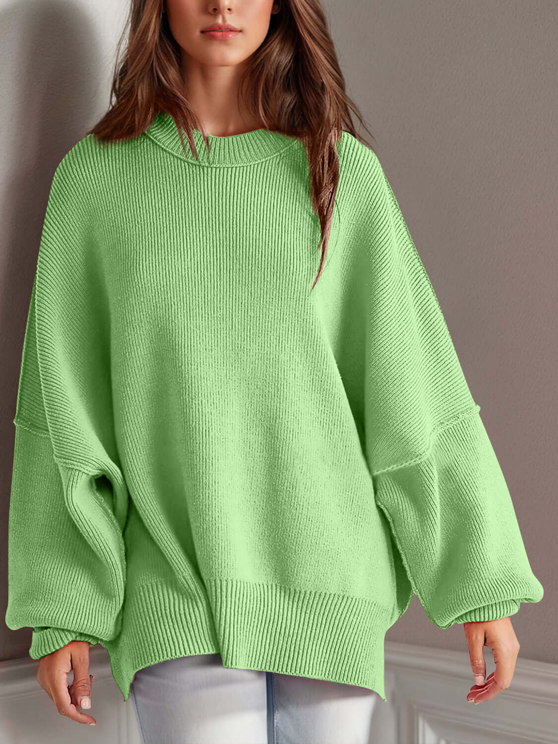 Chic green side-slit sweater with cozy round neck, perfect for winter wardrobe and ultimate comfort.
