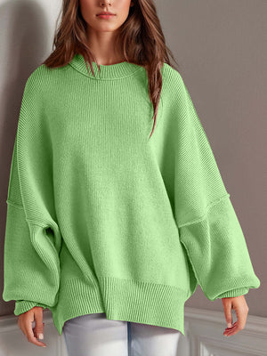 Chic green side-slit sweater with cozy round neck, perfect for winter wardrobe and ultimate comfort.