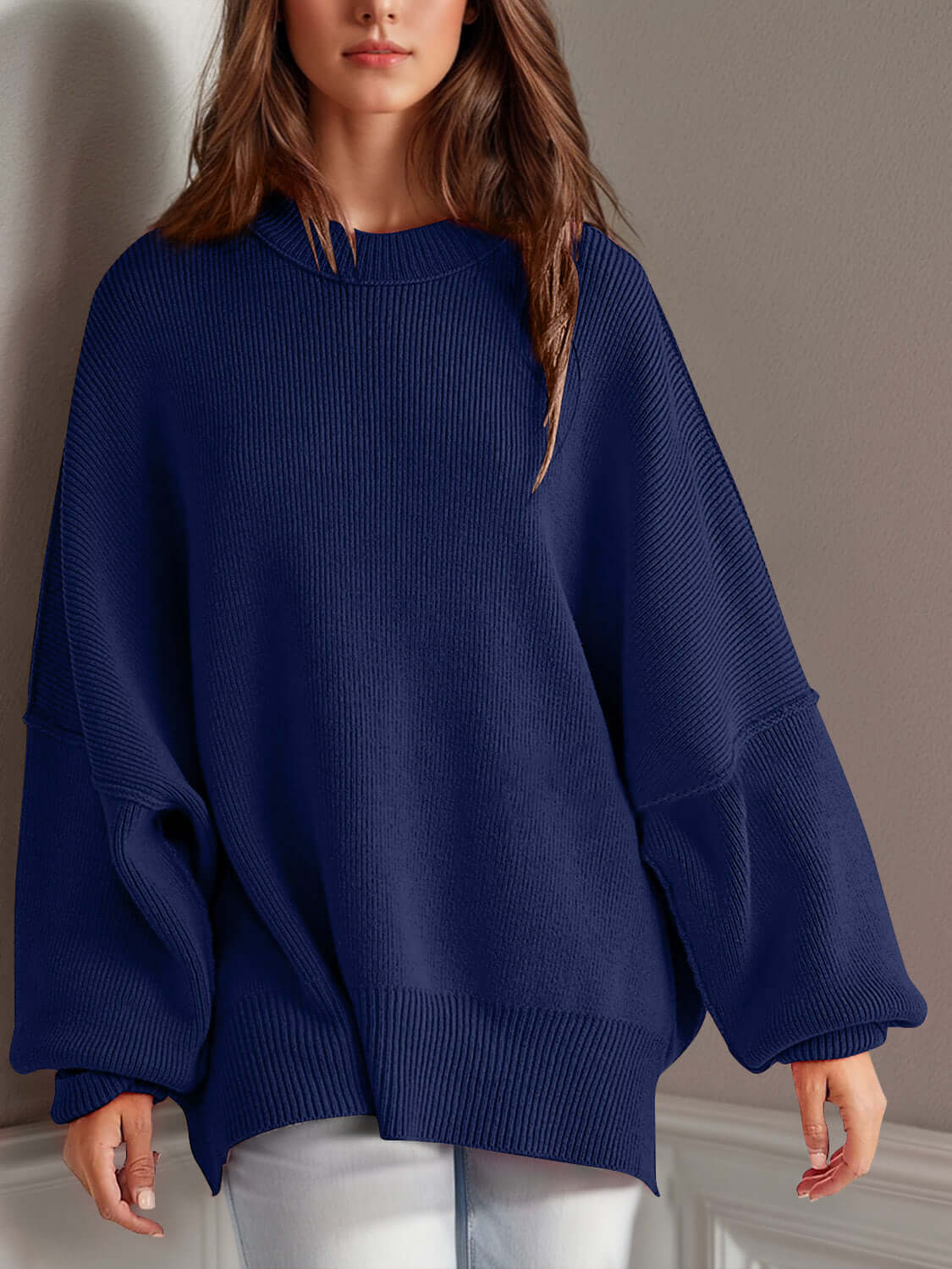 Chic side-slit sweater in navy blue with cozy round neck and relaxed fit, perfect for winter comfort and style.