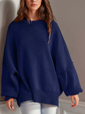 Chic side-slit sweater in navy blue with cozy round neck and relaxed fit, perfect for winter comfort and style.