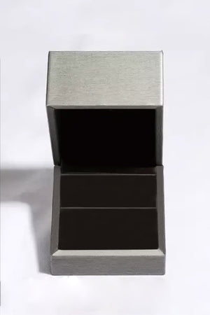 Open jewelry box designed for 2 carat moissanite earrings, featuring a sleek silver finish.