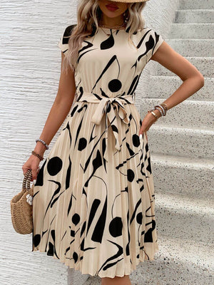 Tied pleated printed cap sleeve dress in beige with black abstract patterns, perfect for casual outings.