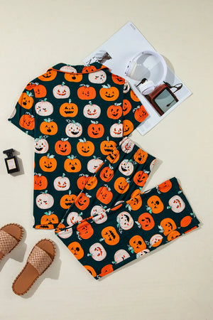 Pumpkin printed short sleeve top and pants lounge set with playful Halloween designs on a light background.
