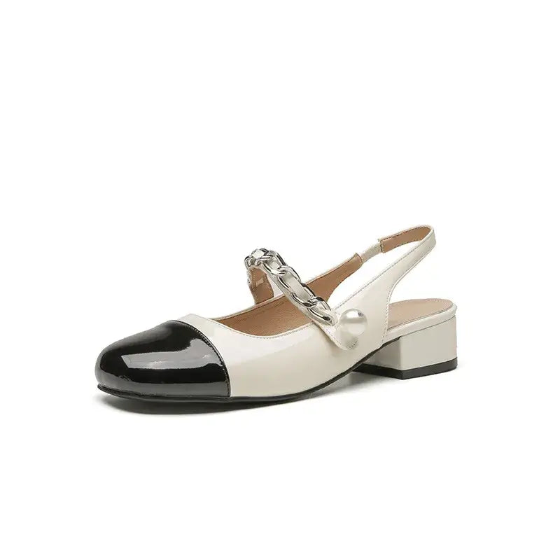 Contrast round toe block heel Mary Jane shoes in black and white with chain detail, perfect for stylish comfort.