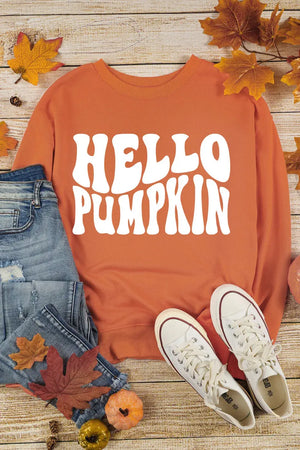 Hello Pumpkin long sleeve sweatshirt styled with jeans and white sneakers, perfect for fall fashion.