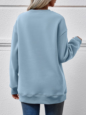 Back view of a cozy blue sweatshirt featuring a round neck and relaxed fit, perfect for casual winter wear.