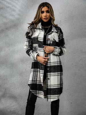 Plaid collared long sleeve coat in black and white worn over a turtleneck, perfect for stylish layering.