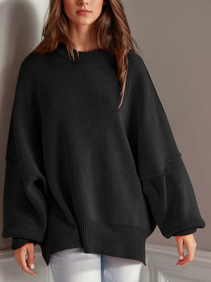 Chic side-slit sweater in cozy round neck design, featuring oversized sleeves and ribbed texture for ultimate comfort.