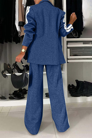 Woman in a blue contrast lapel collar top and pants set, showcasing a stylish two-piece outfit.
