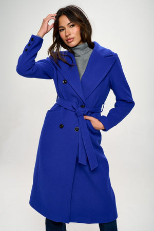 Coalition LA double-breasted longline coat in vibrant blue with stylish belt, perfect for elegant layering.